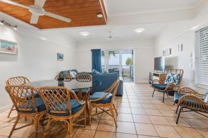 a dining room with a table and chairs at Villa 30 Tangalooma in Tangalooma