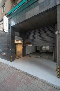 an entrance to a building with a parking garage at Hotel Whooahan Suyu in Seoul