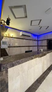 a bar with a bird perched on top of it at صالة المدينة 2 in Medina +40 photos