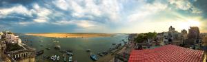 a view of a river with boats in the water at Kashiyana in Varanasi