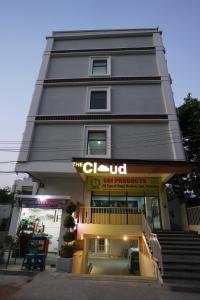 a tall building with a sign in front of it at TheCloud Hotel in Nizāmābād