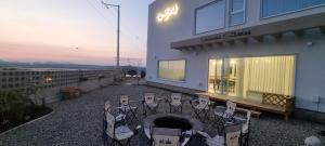 a patio with a table and chairs outside of a building at Paju Seolreda in Paju +87 photos