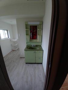 a bathroom with a sink and a mirror at 大宇陀souw創 in Uda +164 photos