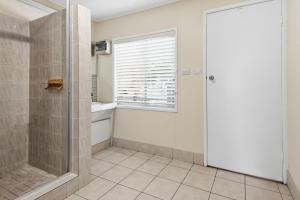 a bathroom with a shower and a glass door at Curlew Corner in Cowan Cowan +11 photos