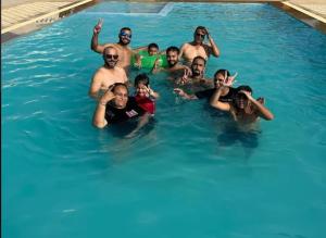 a group of people in a swimming pool at Jaisalmer Villa Resort & Camp Jaisalmer in Jaisalmer