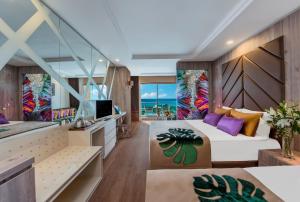 A television and/or entertainment centre at Delphin BE Grand Resort