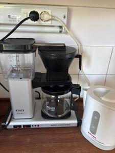 a blender sitting on top of a counter at Viksjo Centrum Apartment in Järfälla