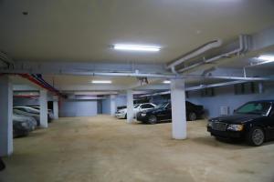 a parking lot with several cars parked in it at Atlas Hotel in Ulaanbaatar