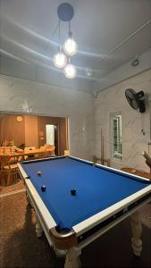 a billiard table in a living room with at 365Poolvilla Songkhla in Ban Laem Takhian