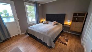 a bedroom with a bed with two pillows on it at Prestelandet Guesthouse in Fredrikstad +37 photos