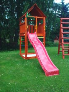 Herní místnost nebo prostor pro děti v ubytování Apartmány V Zahradě + 6 fotografií