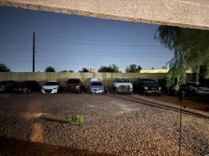 a group of cars parked in a parking lot at Goodyear 2 Story Room 2 in Goodyear