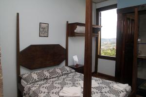 מיטה או מיטות בחדר ב-Pousada Gamarano