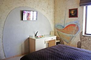 TV a/nebo společenská místnost v ubytování Hotel Wine Palace