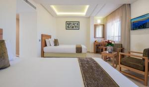 Postel nebo postele na pokoji v ubytování Hotel Ayoub & Spa