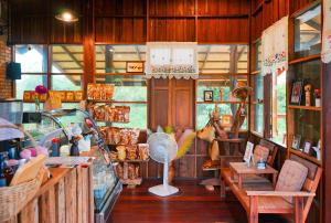 a shop with a fan in the middle of a room at Baannok at Motakhian in Pak Chong +41 photos