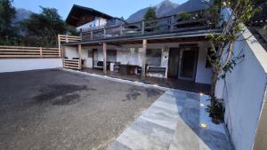 a house with a large parking lot in front of it at apartment harmony in Sautens