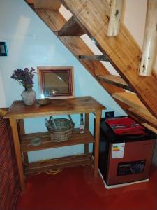 a room with a table and a mirror on a stairs at Sami Huaypo Cabin in Cheqquerec +20 photos