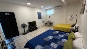 a room with a bedroom with a bed and a tv at Beit Shalom habitaciones con clima in Orizaba +26 photos