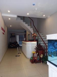 a hallway with a staircase in a building at Bach Khoa Hotel in Hanoi