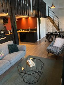 a living room with a couch and a table at L atelier de Jules in Lyon +13 photos