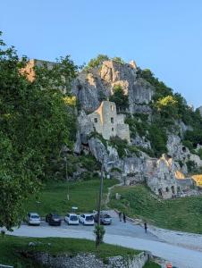 a mountain with cars parked in a parking lot at Ivan in Kalnik +7 photos