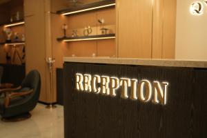 a sign that says reputation on a counter in a store at Qyzylorda Hotel in Kyzylorda