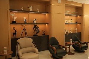 a room with chairs and other items on display at Qyzylorda Hotel in Kyzylorda