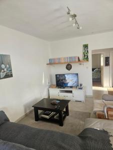 a living room with a couch and a table at VanjAna in Đenovići