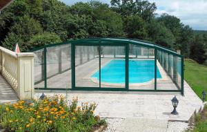 a gazebo with a pool in a yard at Ancienne Forge Avec Piscine in Saint-Mesmin +14 photos