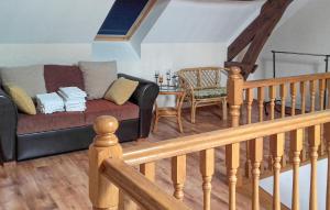 a living room with a couch and a table at Ancienne Forge Avec Piscine in Saint-Mesmin