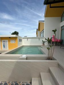 a swimming pool on the roof of a house at Rimna Pool Villa in Hat Yai