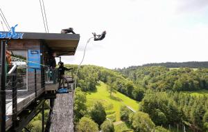 a person on a gondola ride in the sky at Belle Maison À Colombages in La Baroche-sous-Lucé +23 photos
