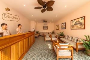 two men standing at the bar in a waiting room at The Jam Boutique Hotel in Luang Prabang +214 photos
