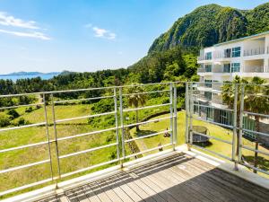 a balcony with a view of a mountain at Y Resort Jeju in Seogwipo