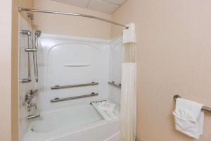 a bathroom with a white tub and a shower at Days Inn by Wyndham Budd Lake in Budd Lake +30 photos