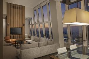 a living room with a couch and a table at Park Hyatt Shanghai in Shanghai +173 photos