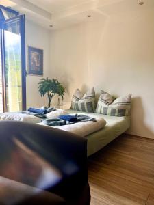 a bedroom with a bed with pillows on it at EukaVita in Banja Koviljača