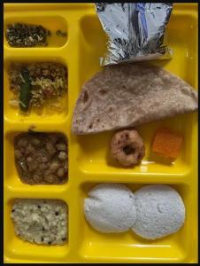 a plastic container filled with different types of food at Le Tamara Suite - TIE in Auroville