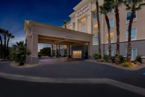 a rendering of the front of a hotel with palm trees at Hampton Inn & Suites El Paso West in Borderland