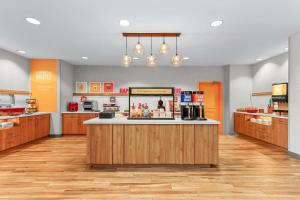 a large kitchen with a counter in a store at Hampton Inn & Suites El Paso West in Borderland