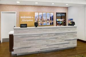a welcome manager counter in a store lobby at Hampton Inn & Suites Detroit/Troy in Clawson +33 photos