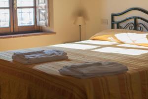 Letto o letti in una camera di Frantoio di Corsanico