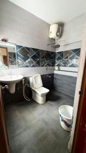 a bathroom with a toilet and a sink at 11 Haven Street Kodaikanal in Kodaikānāl +98 photos