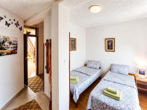 a room with a bed and a couch in it at Villa Flora in Ohrid