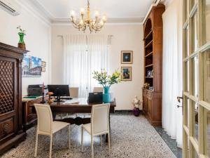 an office with a desk with a computer on it at Villa Catelli in Lucca