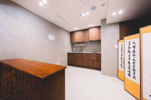 a kitchen with a wooden counter in a room at Seoul101 Jongno in Seoul