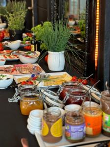 a long table with many different types of food at Hotel am Doktorplatz in Rheda-Wiedenbrück