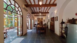 a hallway of a house with a dining room and a kitchen at Gratitude Heritage in Pondicherry
