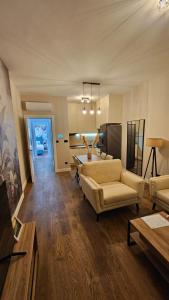 a living room with a couch and a table at Damisa Lux Stan in Tivat